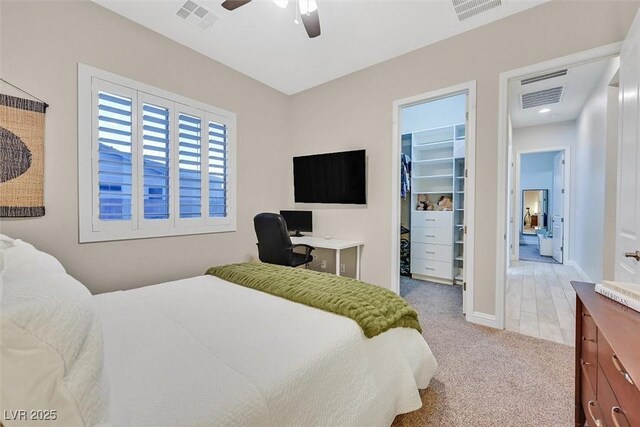 5801 Exbury Gardens Ct, Las Vegas, NV 89118 - carpeted bedroom with a walk in closet, a closet, and ceiling fan