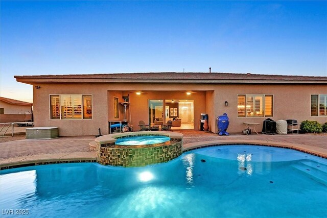 5801 Exbury Gardens Ct, Las Vegas, NV 89118 - view of swimming pool featuring a patio area and a pool with connected hot tub