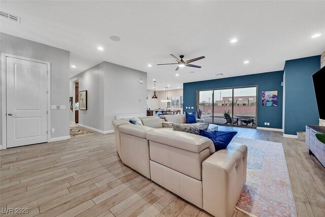 5801 Exbury Gardens Ct, Las Vegas, NV 89118 - living room featuring light wood-style flooring, ceiling fan, and recessed lighting