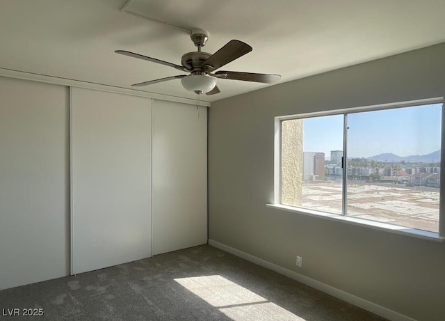 745 N Royal Crest Cir Unit 157, Las Vegas, NV 89169 - unfurnished room featuring a mountain view, carpet flooring, and ceiling fan