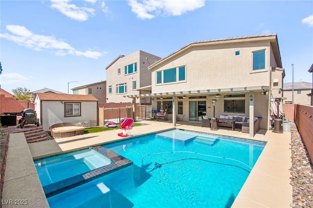 8955 Ruby Moon Dr, Las Vegas, NV 89139 - view of pool with outdoor lounge area, a fenced backyard, a pool with connected hot tub, a patio, and a shed