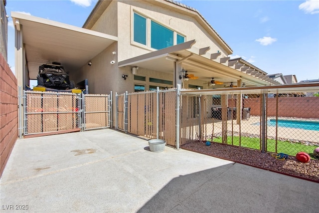 8955 Ruby Moon Dr, Las Vegas, NV 89139 - view of patio featuring a gate, an attached carport, and a ceiling fan