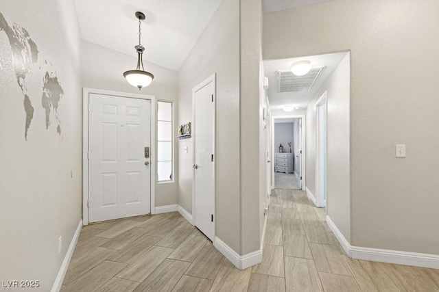 5108 Molveno Ct, Las Vegas, NV 89130 - entrance foyer featuring wood tiled floors and lofted ceiling