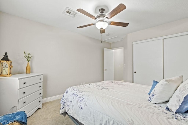 5108 Molveno Ct, Las Vegas, NV 89130 - bedroom with light carpet, a closet, and a ceiling fan