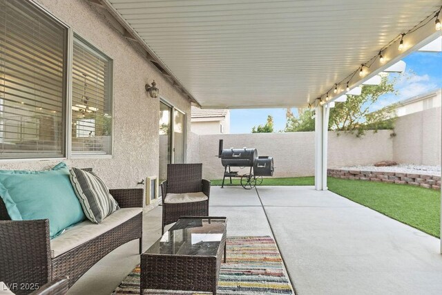 5108 Molveno Ct, Las Vegas, NV 89130 - fenced backyard featuring a patio, an outdoor hangout area, and area for grilling