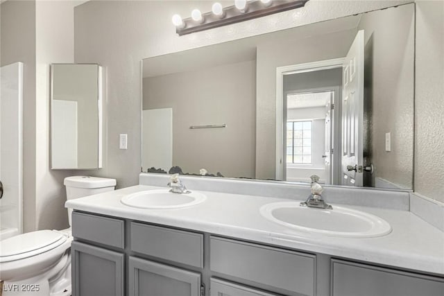 5734 Duval Dr, Las Vegas, NV 89156 - full bathroom featuring double vanity and a textured wall
