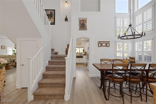 1246 Diamond Valley St, Henderson, NV 89052 - stairs with a high ceiling, wood finished floors, arched walkways, and plenty of natural light