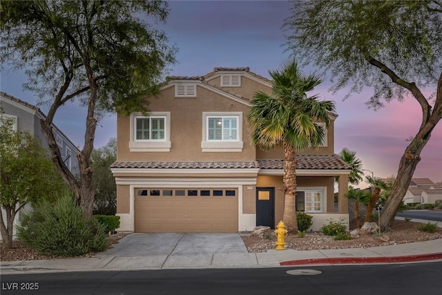 1246 Diamond Valley St, Henderson, NV 89052 - view of front facade featuring stucco siding, driveway, a garage, and a tile roof