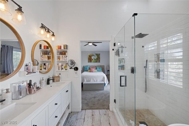 1246 Diamond Valley St, Henderson, NV 89052 - ensuite bathroom with double vanity, a shower stall, ceiling fan, and wood finished floors