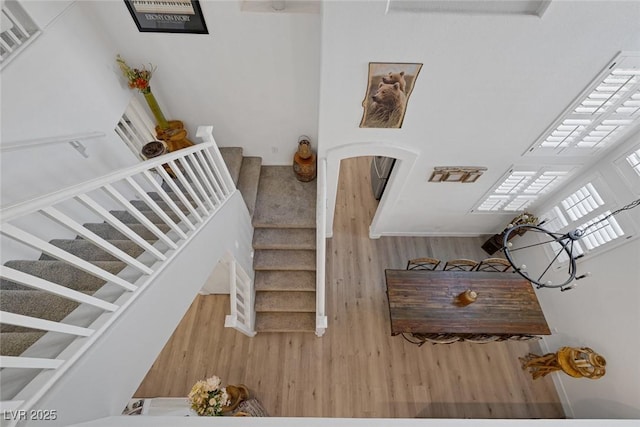 1246 Diamond Valley St, Henderson, NV 89052 - stairway featuring wood finished floors and arched walkways