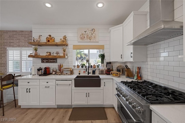 1246 Diamond Valley St, Henderson, NV 89052 - kitchen featuring wall chimney exhaust hood, high end stove, healthy amount of natural light, light countertops, and recessed lighting