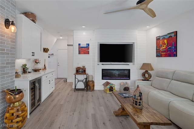 1246 Diamond Valley St, Henderson, NV 89052 - living room featuring wine cooler, light wood-style flooring, ceiling fan, recessed lighting, and a fireplace