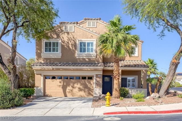 1246 Diamond Valley St, Henderson, NV 89052 - view of front facade featuring driveway, an attached garage, a tile roof, and stucco siding