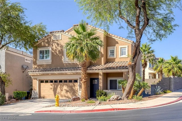 1246 Diamond Valley St, Henderson, NV 89052 - view of front of home featuring a garage, driveway, a tiled roof, and stucco siding