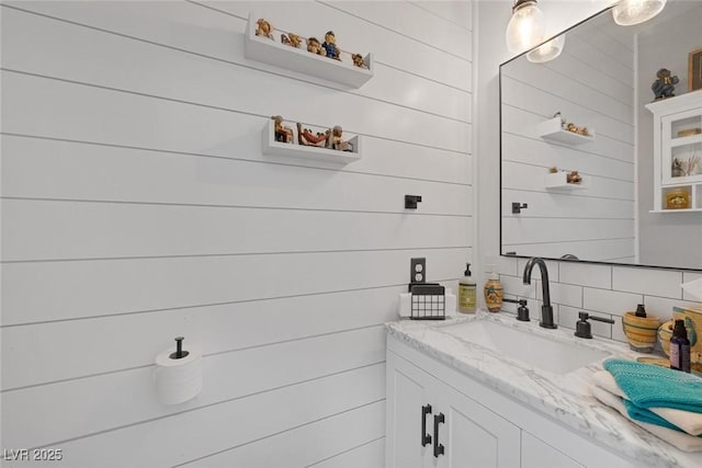 1246 Diamond Valley St, Henderson, NV 89052 - bathroom featuring backsplash, vanity, and wood walls