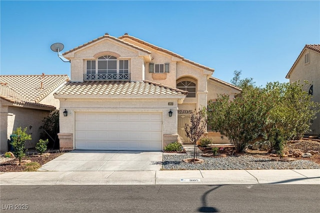 9105 Chenin Ave, Las Vegas, NV 89129 - mediterranean / spanish-style house featuring a tile roof, driveway, and stucco siding