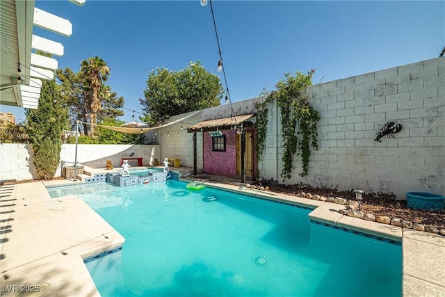 9105 Chenin Ave, Las Vegas, NV 89129 - view of pool with a fenced backyard and a pool with connected hot tub