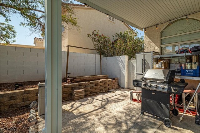 9105 Chenin Ave, Las Vegas, NV 89129 - fenced backyard featuring area for grilling and a patio