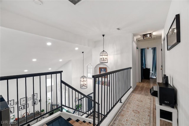 9105 Chenin Ave, Las Vegas, NV 89129 - hall featuring a chandelier, an upstairs landing, light wood finished floors, and recessed lighting