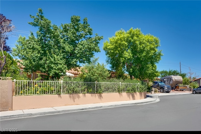 3877 Platis Cir, Las Vegas, NV 89103 - view of asphalt road featuring sidewalks and curbs