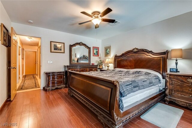 3877 Platis Cir, Las Vegas, NV 89103 - bedroom featuring wood finished floors and a ceiling fan