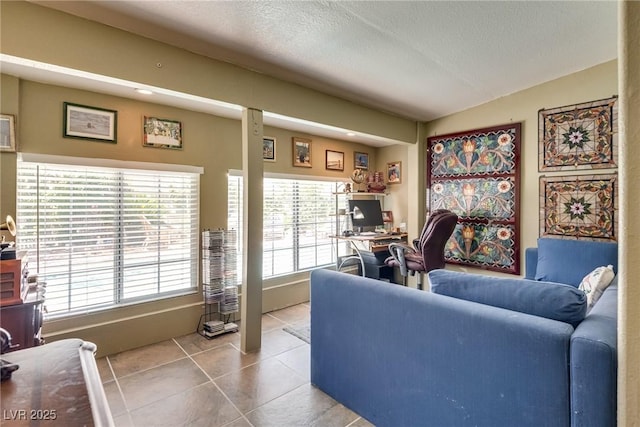 3877 Platis Cir, Las Vegas, NV 89103 - living room with an office area, tile patterned flooring, and a textured ceiling
