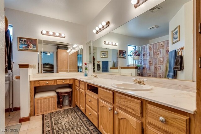 3877 Platis Cir, Las Vegas, NV 89103 - bathroom featuring tile patterned flooring and double vanity