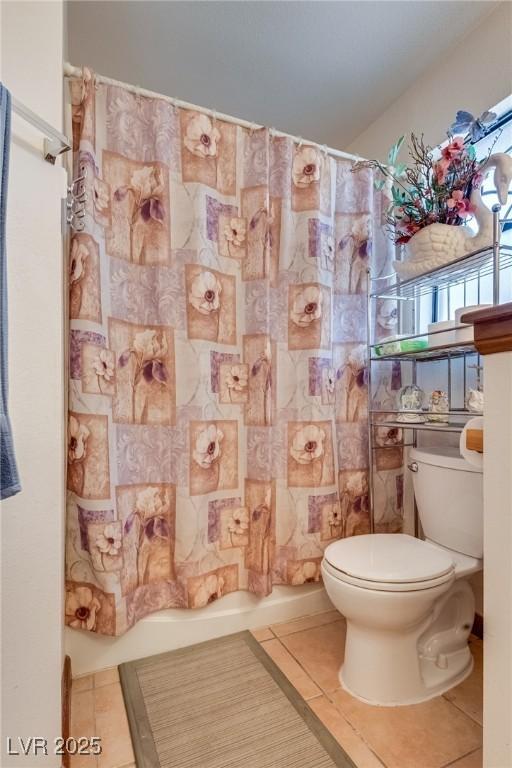 3877 Platis Cir, Las Vegas, NV 89103 - full bathroom featuring tile patterned floors and shower / tub combo with curtain