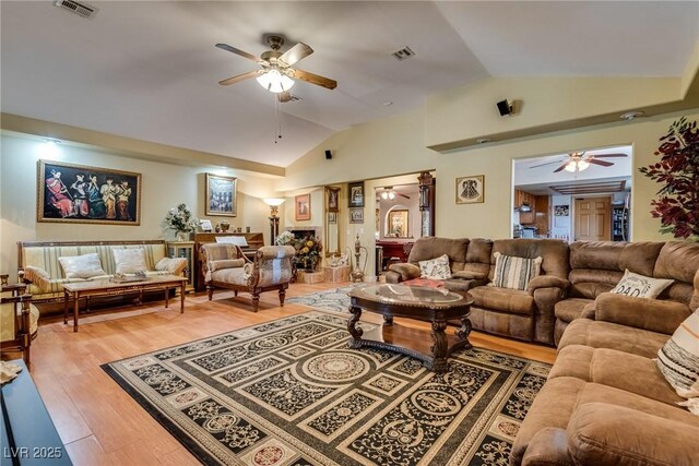 3877 Platis Cir, Las Vegas, NV 89103 - living area with ceiling fan, vaulted ceiling, and light wood-style floors