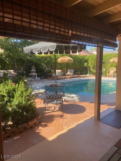 3877 Platis Cir, Las Vegas, NV 89103 - view of swimming pool featuring a patio area