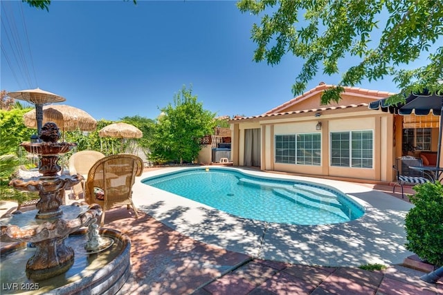 3877 Platis Cir, Las Vegas, NV 89103 - view of swimming pool featuring a patio area and an outbuilding