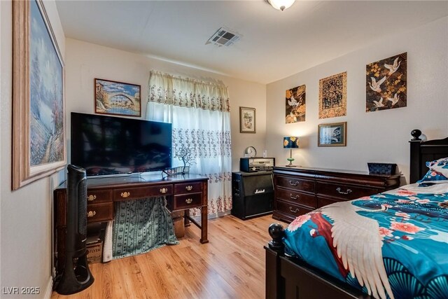 3877 Platis Cir, Las Vegas, NV 89103 - bedroom with light wood-style flooring