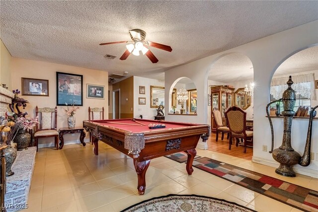 3877 Platis Cir, Las Vegas, NV 89103 - playroom with arched walkways, ceiling fan, a textured ceiling, billiards table, and light tile patterned flooring