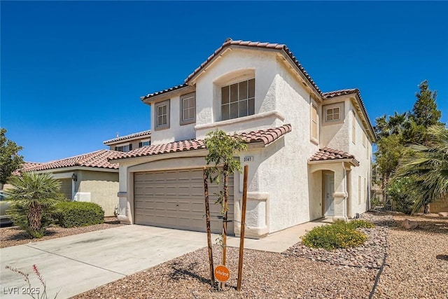 3141 Diamond Crest Ln, Henderson, NV 89052 - mediterranean / spanish home featuring a tiled roof, concrete driveway, stucco siding, and an attached garage