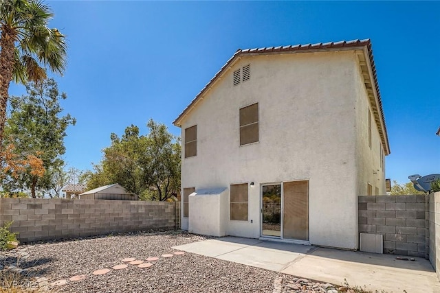 3141 Diamond Crest Ln, Henderson, NV 89052 - back of property featuring stucco siding and a patio