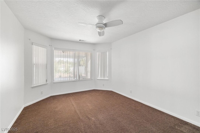 170 Dove St, Pahrump, NV 89060 - unfurnished room featuring dark carpet, ceiling fan, and a textured ceiling