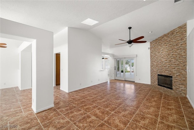 170 Dove St, Pahrump, NV 89060 - unfurnished living room with ceiling fan, a fireplace, lofted ceiling, and tile patterned floors