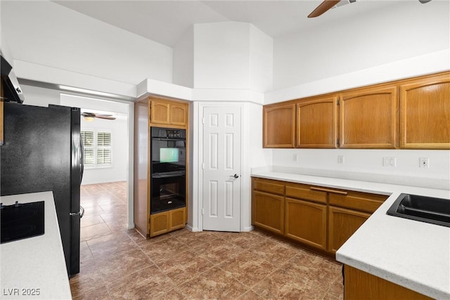 170 Dove St, Pahrump, NV 89060 - kitchen featuring ceiling fan, black appliances, and light countertops