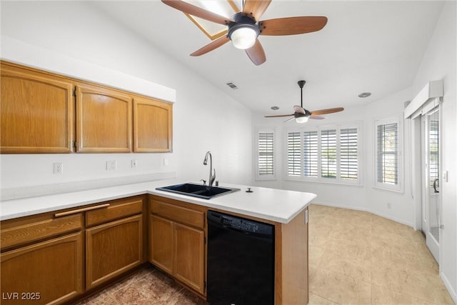 170 Dove St, Pahrump, NV 89060 - kitchen featuring black dishwasher, a peninsula, vaulted ceiling, ceiling fan, and light countertops