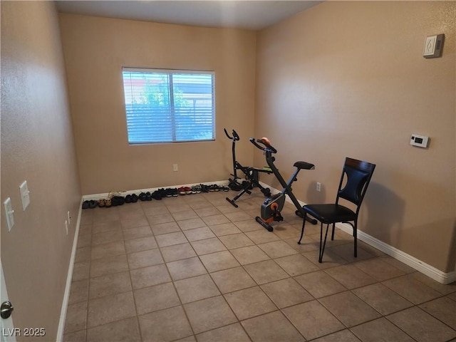 2110 Los Feliz St Unit 1096, Las Vegas, NV 89156 - workout room with light tile patterned floors and baseboards