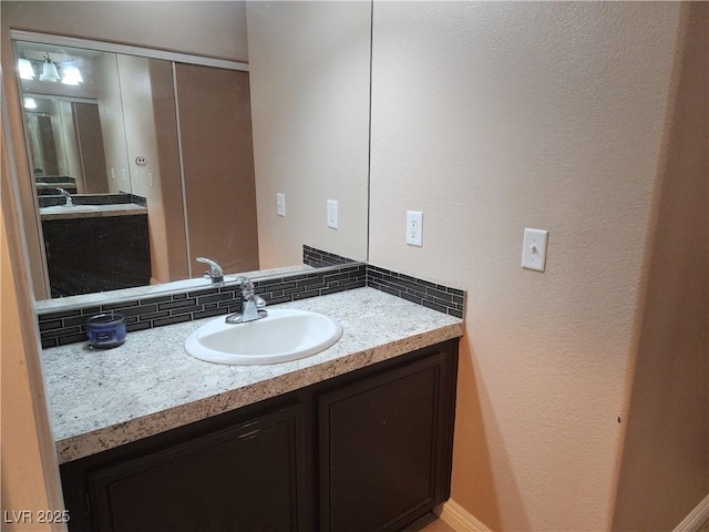 2110 Los Feliz St Unit 1096, Las Vegas, NV 89156 - bathroom with vanity and decorative backsplash