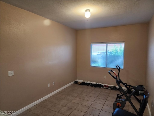 2110 Los Feliz St Unit 1096, Las Vegas, NV 89156 - workout area featuring light tile patterned floors and a textured ceiling