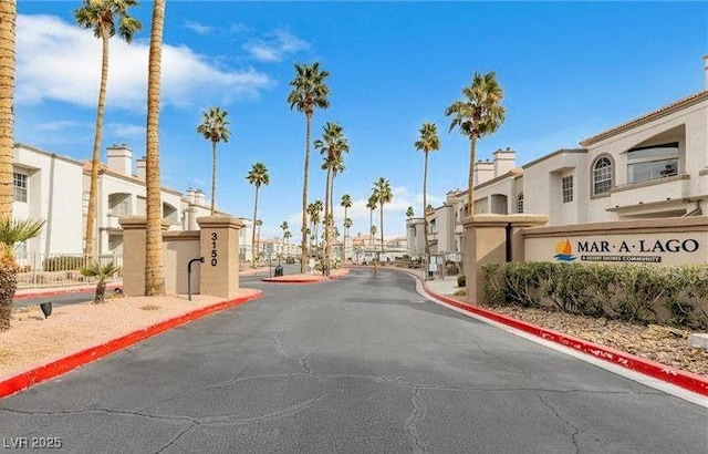 3125 N Buffalo Dr Unit 1133, Las Vegas, NV 89128 - view of asphalt street featuring a residential view, curbs, and a gated entry