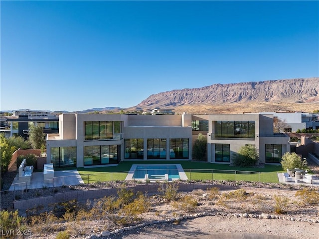 68 Sun Glow Ln, Las Vegas, NV 89135 - back of property with a mountain view, stucco siding, and a patio