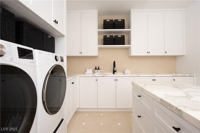 68 Sun Glow Ln, Las Vegas, NV 89135 - laundry area with cabinet space and washing machine and clothes dryer