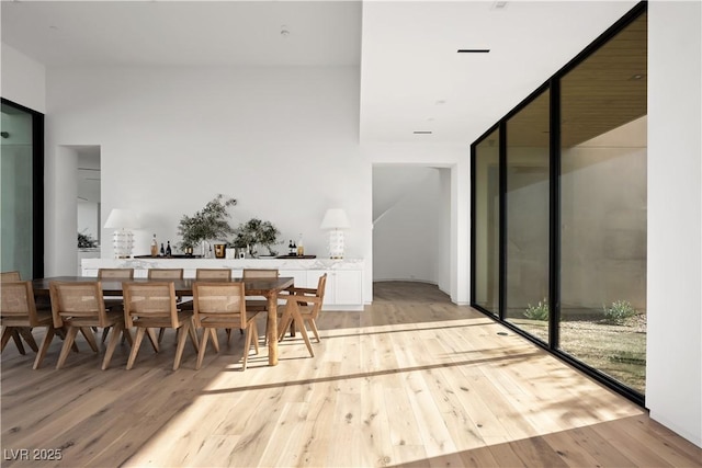 68 Sun Glow Ln, Las Vegas, NV 89135 - dining space featuring light wood-type flooring and floor to ceiling windows