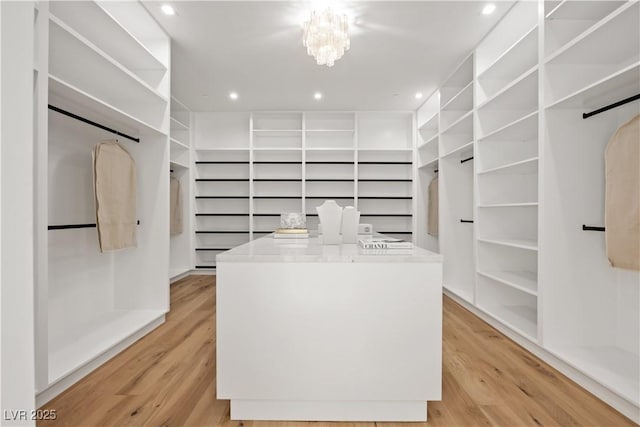 68 Sun Glow Ln, Las Vegas, NV 89135 - spacious closet with light wood-style flooring and a chandelier