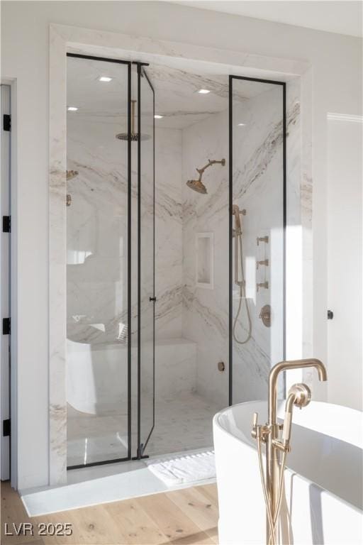 68 Sun Glow Ln, Las Vegas, NV 89135 - full bath with a marble finish shower, a soaking tub, and wood finished floors