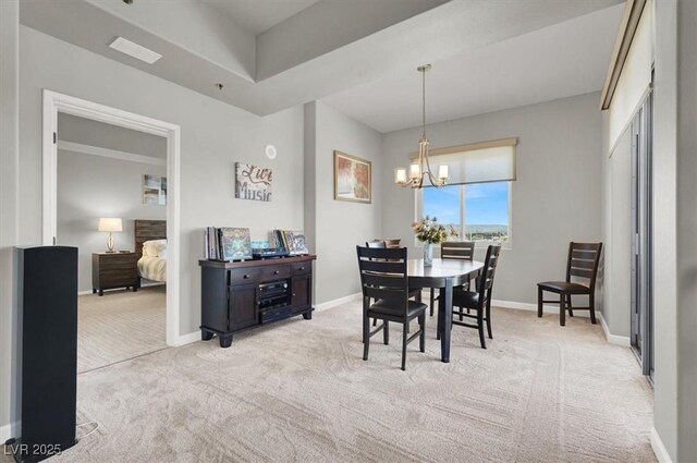 8255 Las Vegas Blvd Unit 722, Las Vegas, NV 89123 - dining room featuring light carpet and a chandelier