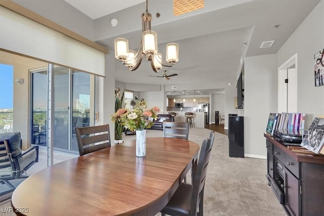 8255 Las Vegas Blvd Unit 722, Las Vegas, NV 89123 - dining space with a chandelier and light carpet